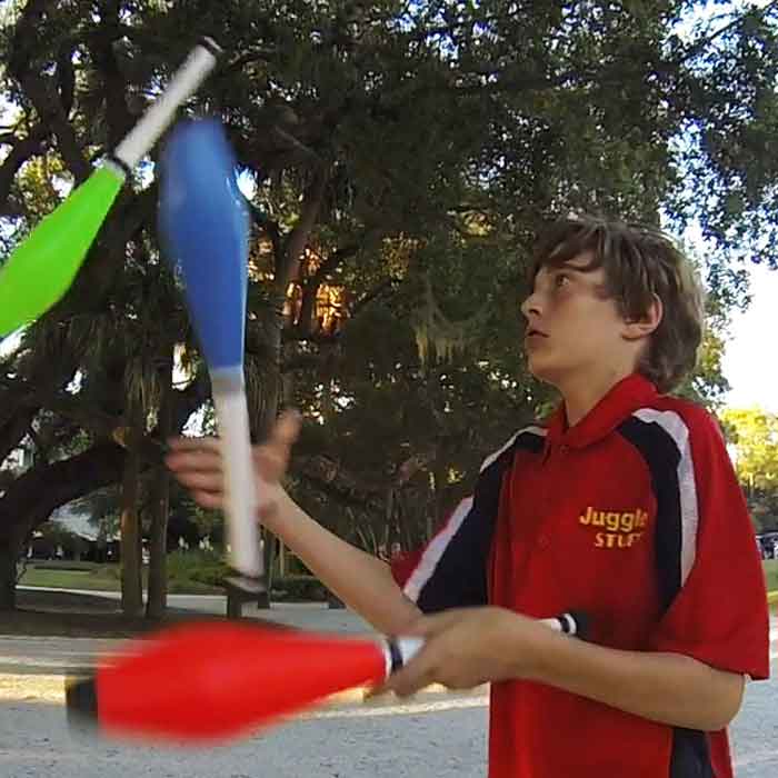 Dillon Juggles Clubs